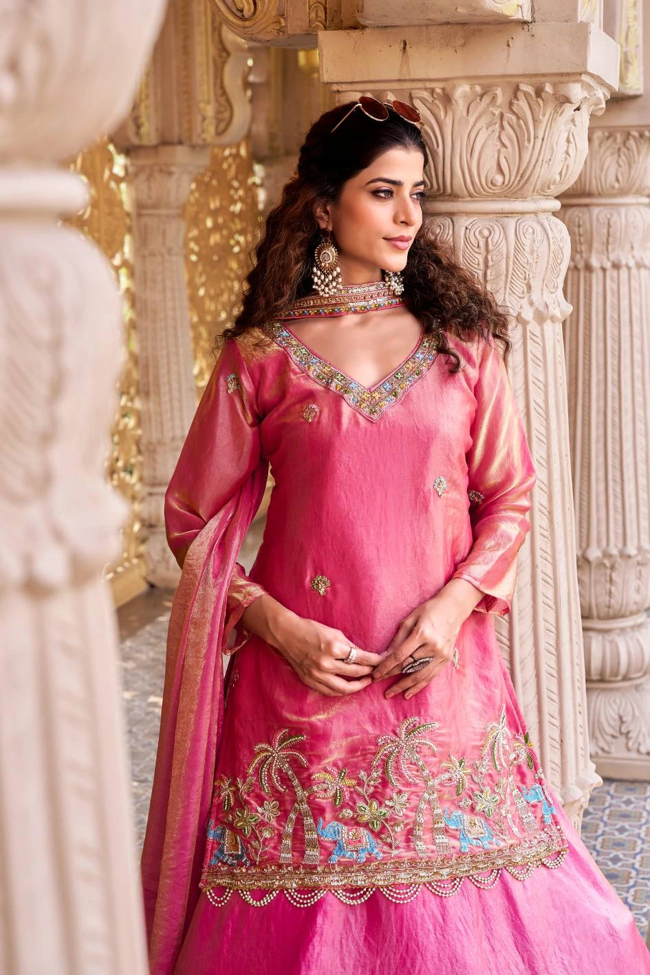 The overall look combines modern fashion with traditional cultural style.